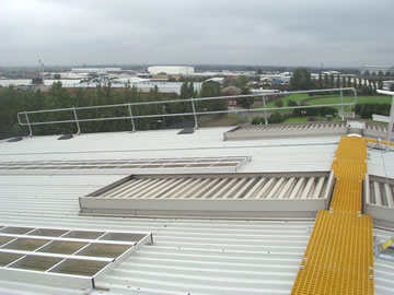A view along the roof ridge showing Clow non-slip walkway and freestanding handrailing